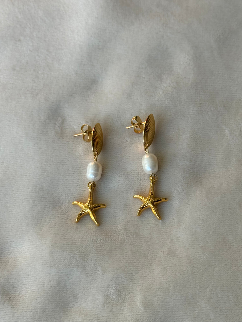 Oorbellen goud/wit zeester