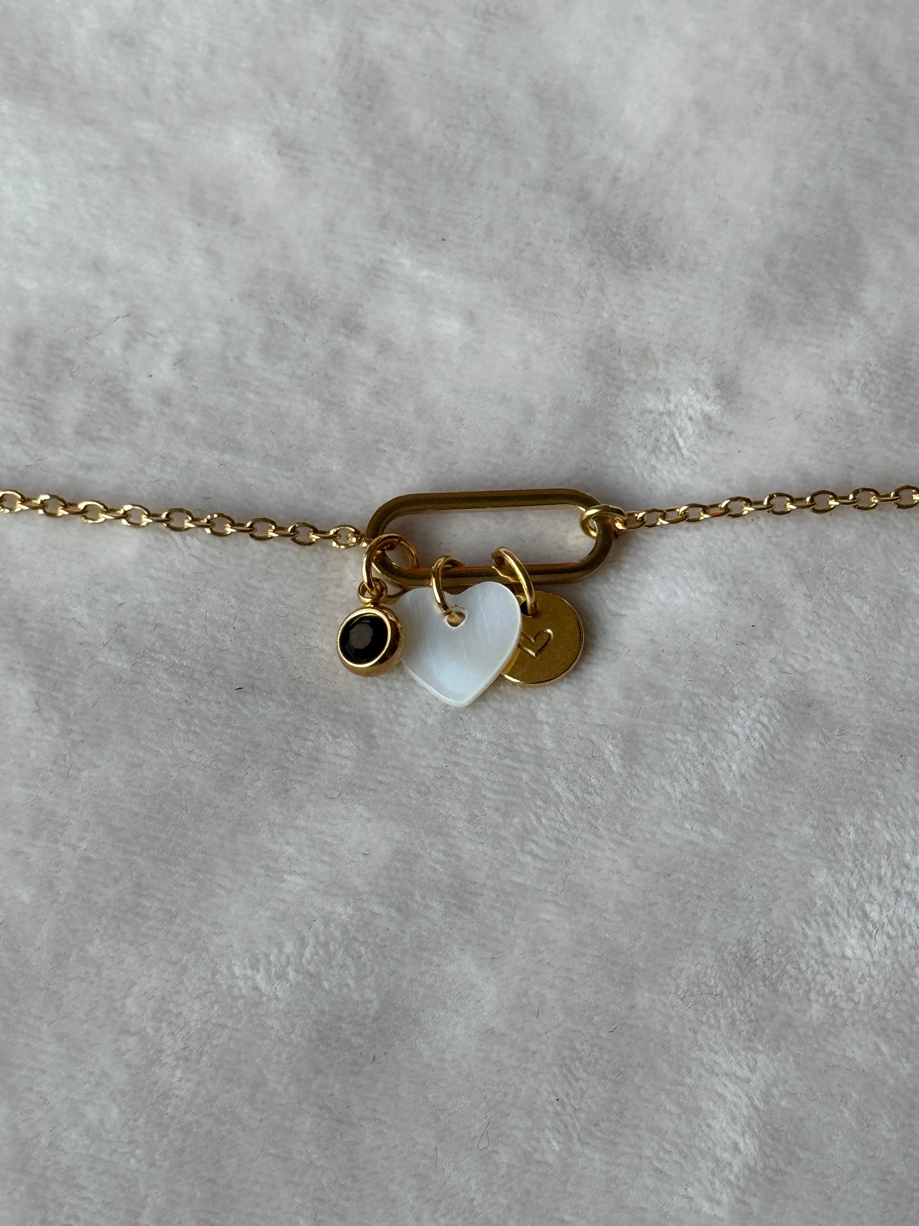 Armband goud/wit/zwart hartje