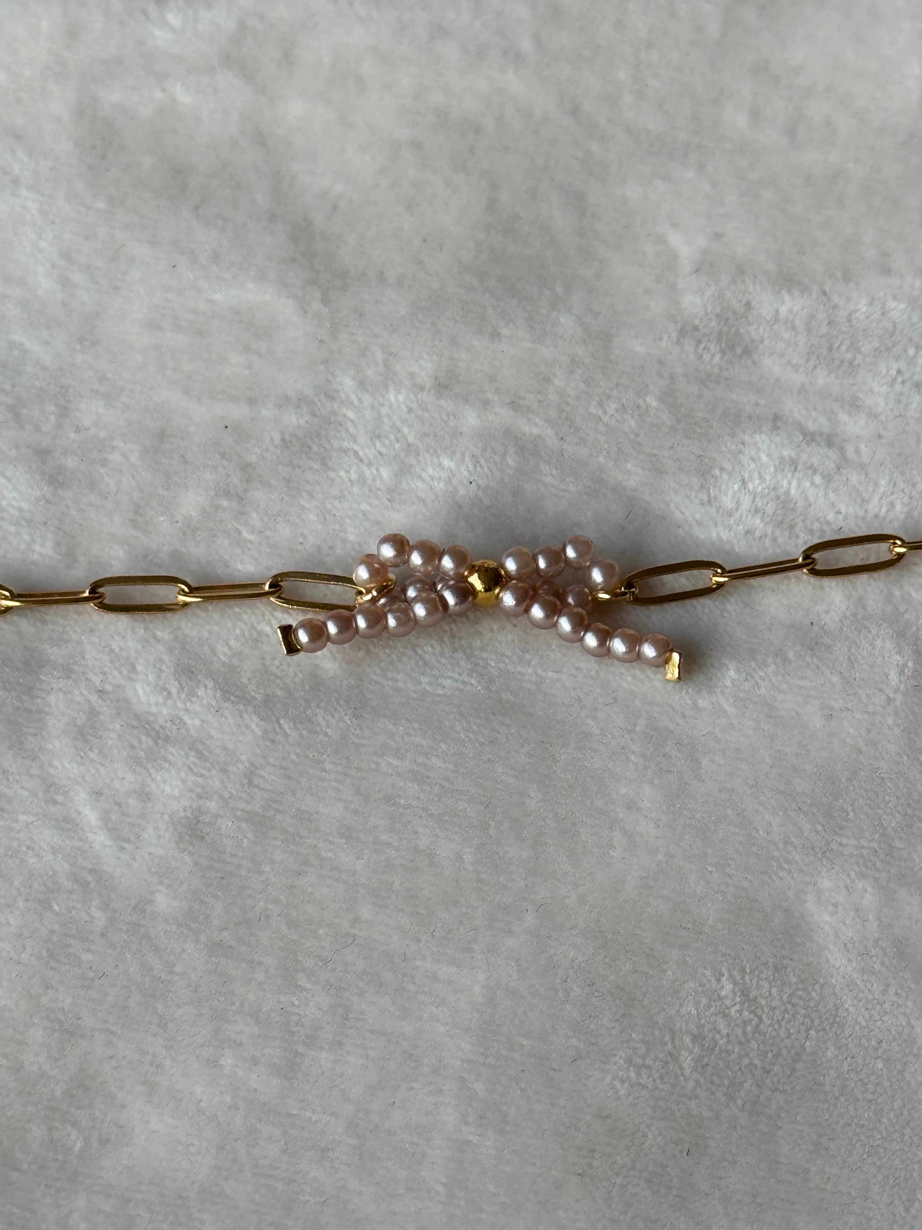 Armband goud strikje