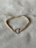 Armband beige/goud hartje