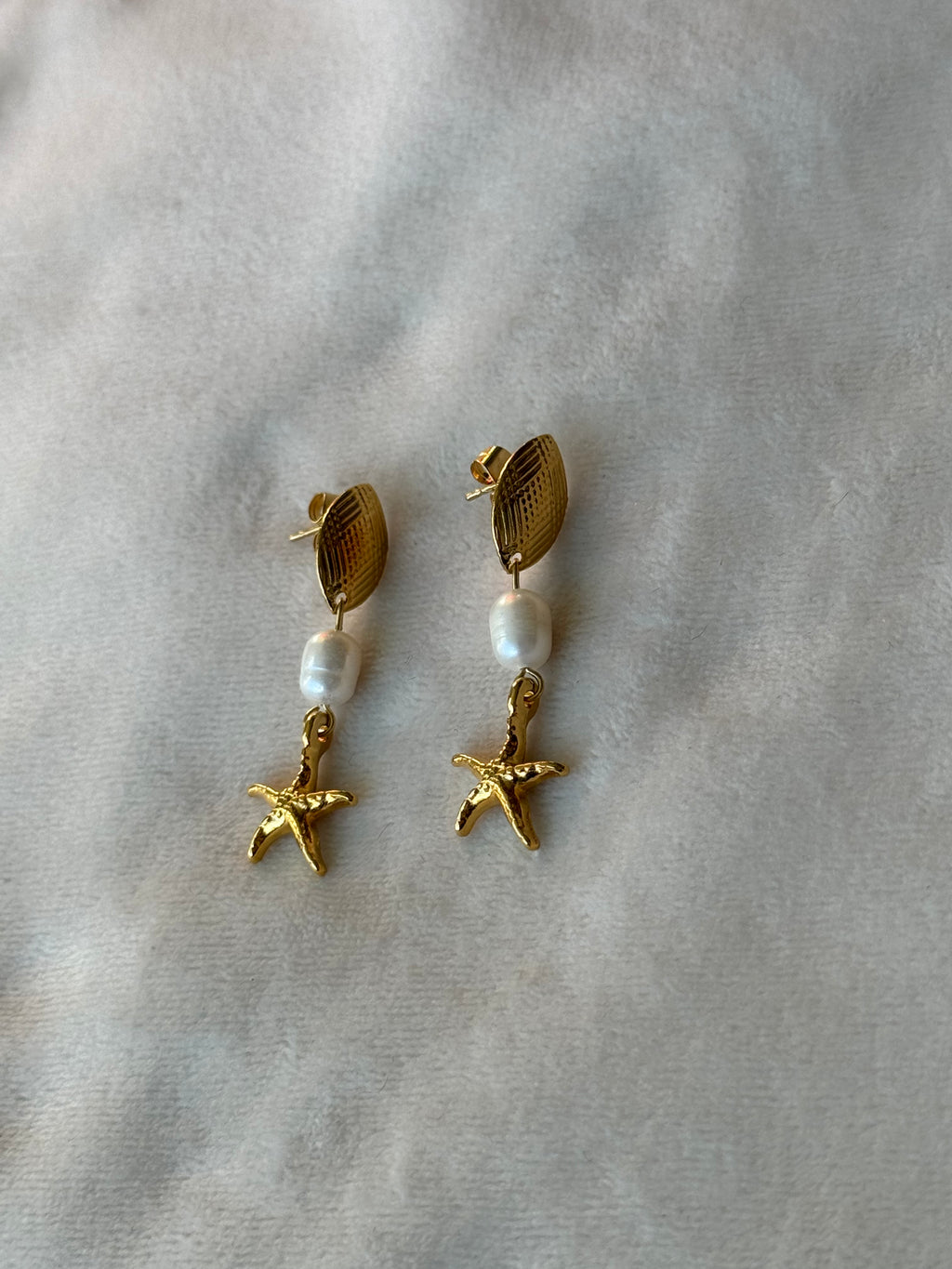 Oorbellen goud/wit zeester