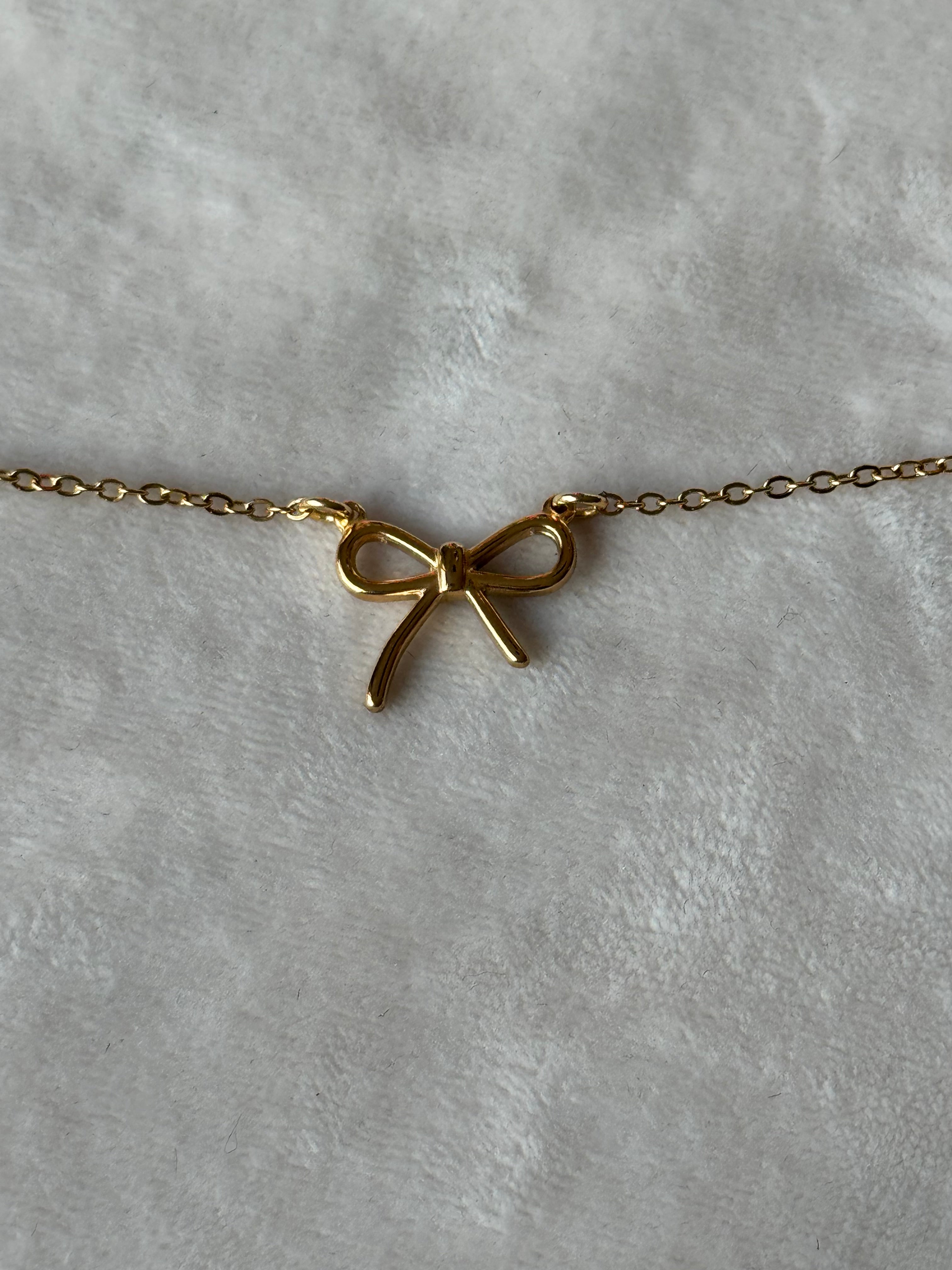 Armband goud strikje